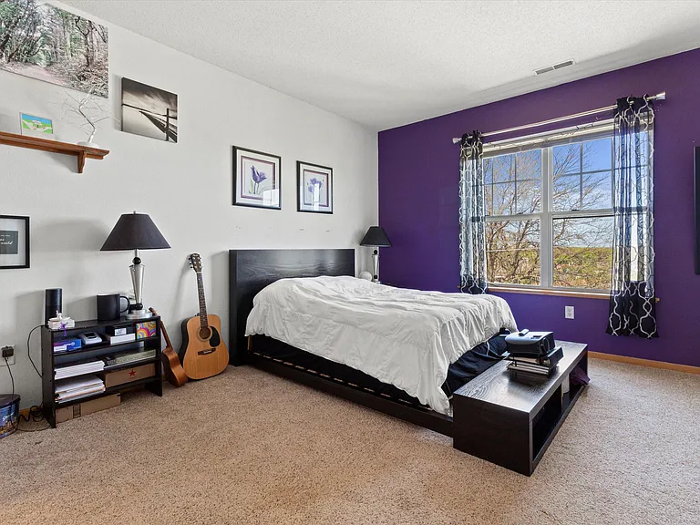 Master suite w/ shower stall and walk-in closet