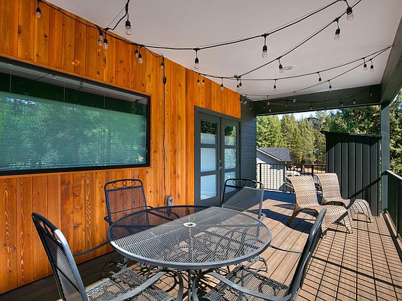 Covered Deck with storage shed.