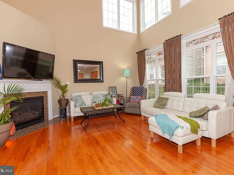 Great Room/ Family Room with 19' cathdral ceiling, lots of windows to let in natural light