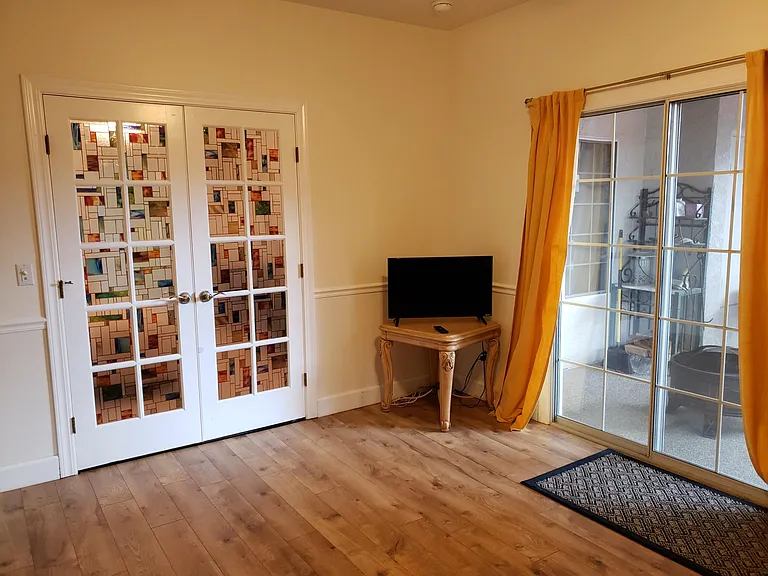 Converted 5th bedroom (in-law suite), showing slider to backyard