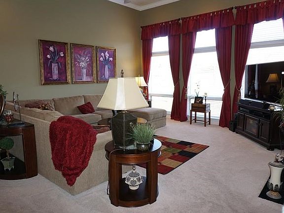 View of the family room from in the dinette!  New carpeting has been done thru out the home as well!