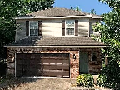 Front of House with a 2 car garage