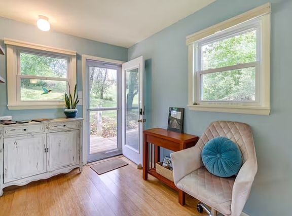 Back door to deck, yard, and parking.