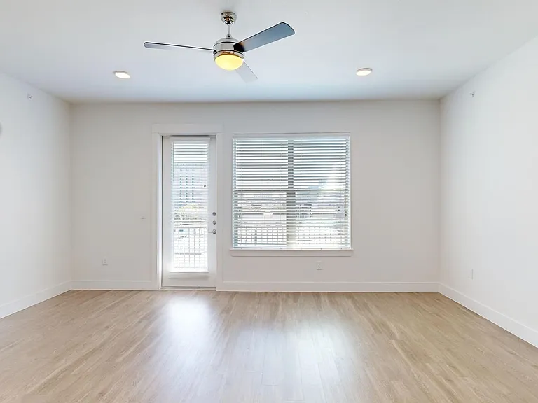 Apartment living room with wood-style flooring.