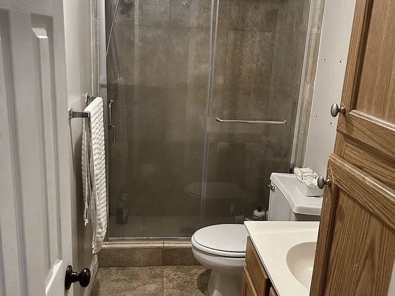 second full bath walk in shower with custom marble surround