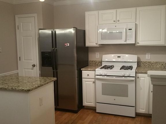 Kitchen with granite countertops;