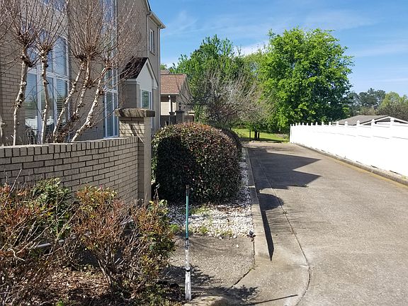 Side view with driveway. 