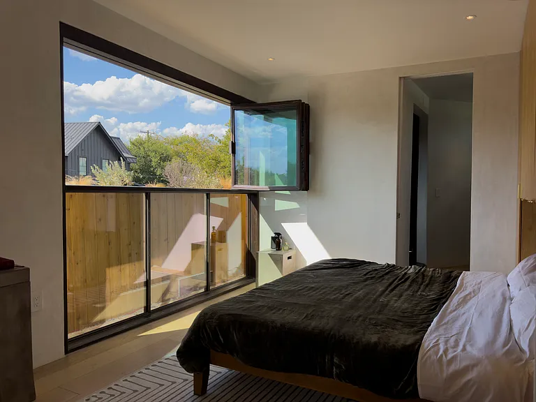 Full accordion windows with planter bed right outside.