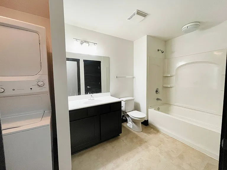 Large bathroom with washer and dryer at 3 Points Loft.