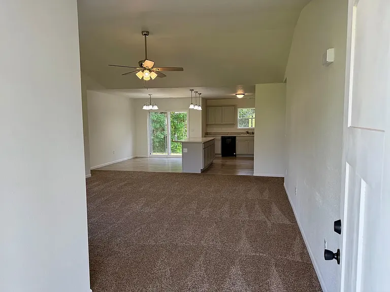 front door looking into living room &kitchen