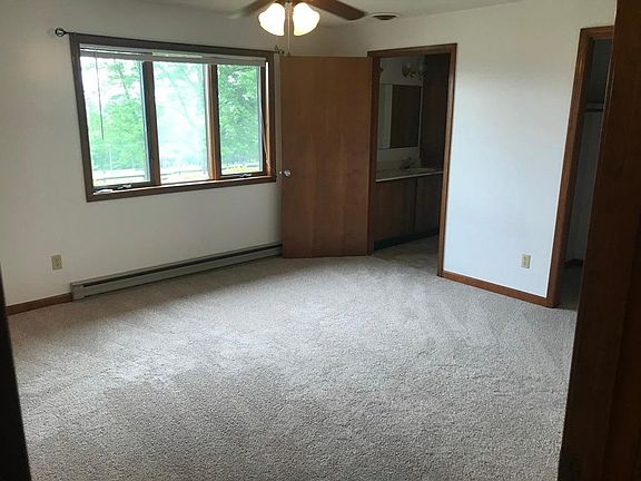 Master bedroom with attached bath and walk-in closet