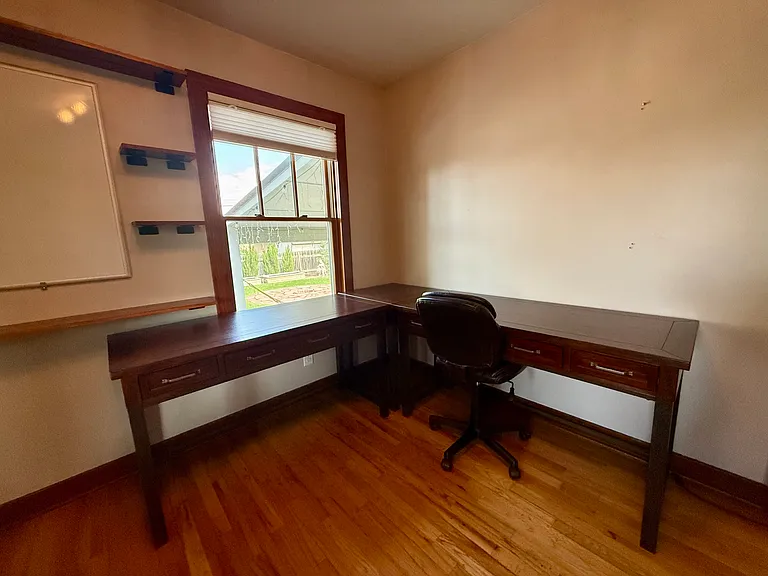 East-facing home office desk with morning sunrise light and garden views