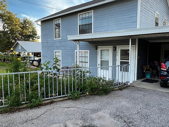 Front of the property. Parking.