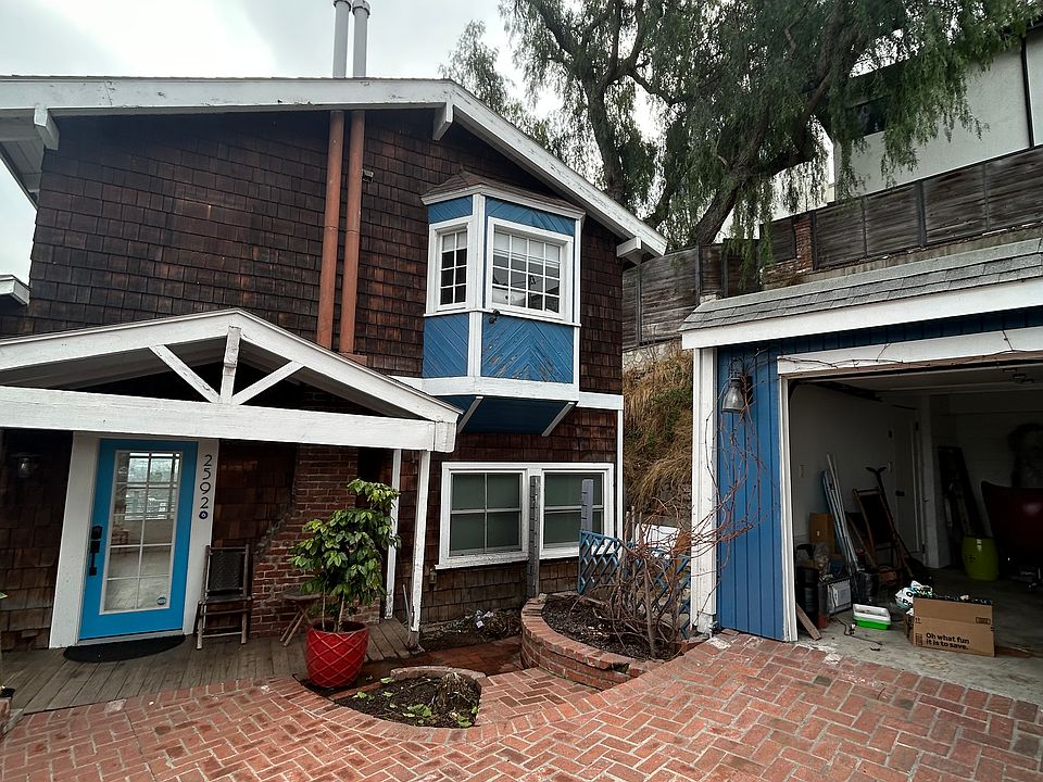 a farm style house situated in a cul de sac with off-street parking available