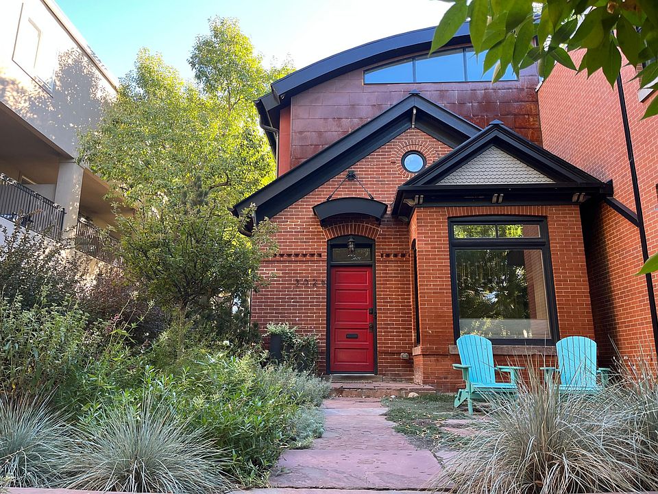 Front of the home with garden and courtyard.