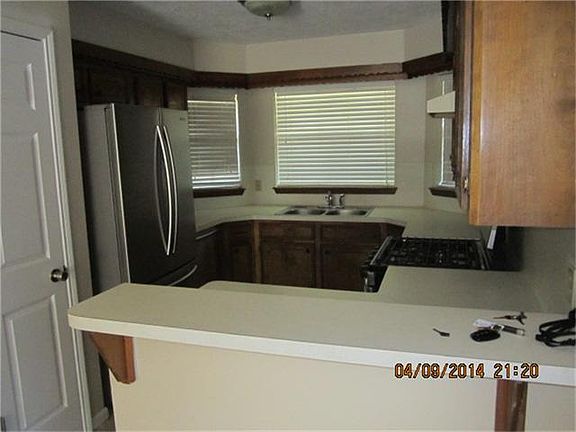 View from living room to kitchen and breakfast area