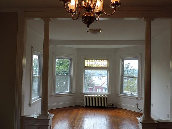 Looking forward towards the front of the apartment. Beautiful columns as you into the living room.