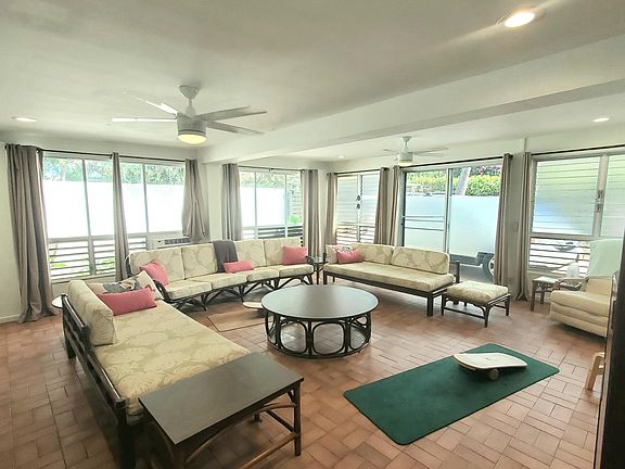 Spacious living room with adjacent laundry and 3/4 bathroom - NEW split AC unit will be installed mid-October