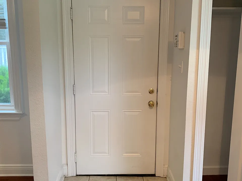 Front Door with entry closet on the right.