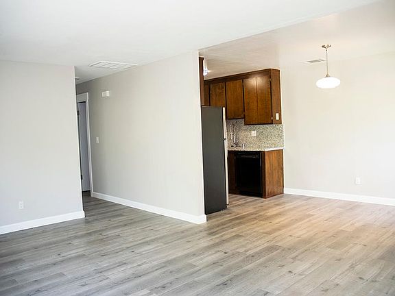 looking towards the dinning area, the kitchen and to the left, the hallway to the bedrooms and bath.