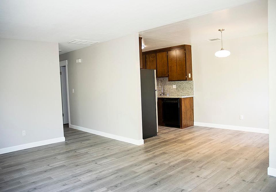 looking towards the dinning area, the kitchen and to the left, the hallway to the bedrooms and bath.