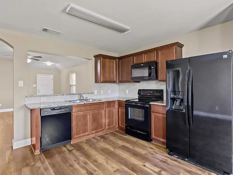 Kitchen, includes refrigerator.