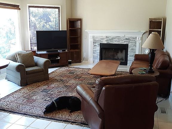 Granite fireplace vaulted rm