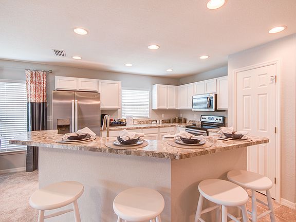Photos showcase the Merlot home layout colors and