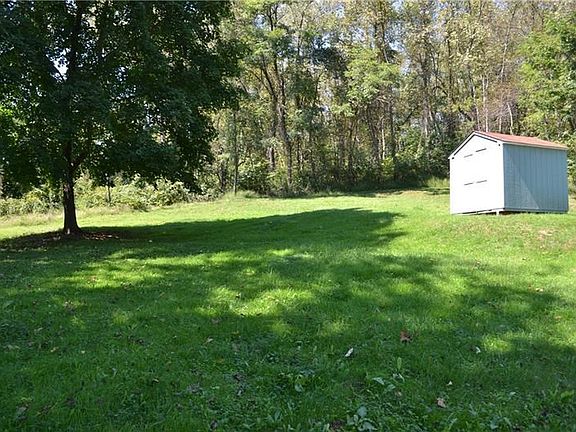 Nice and private rear yard includes shed.