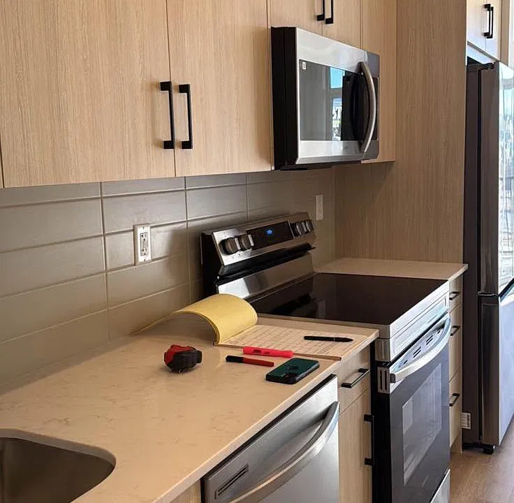 Kitchen counter, dishwasher, cainets, microwave, fridge