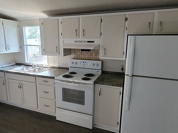 Kitchen, also has built in buffet on other side.