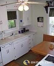 Kitchen has dishwasher. Table and bench stay