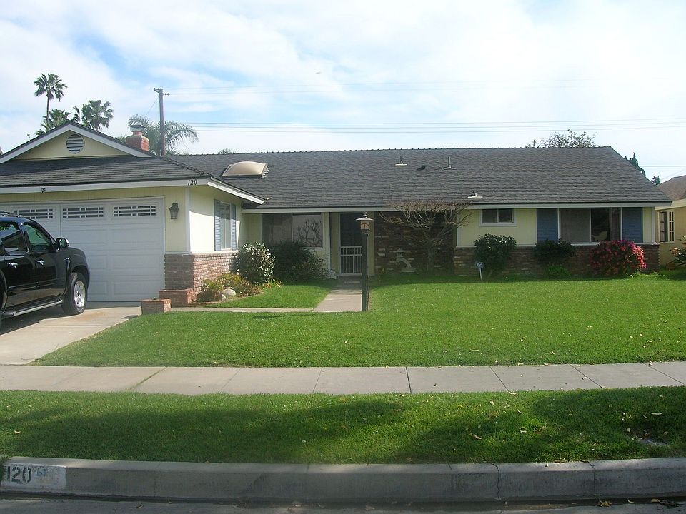 yellow house, blue shutter