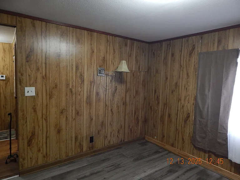 master bedroom -reading lamp -window to south side of home.
