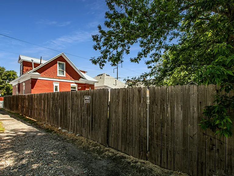 Gate with room to park one car behind house