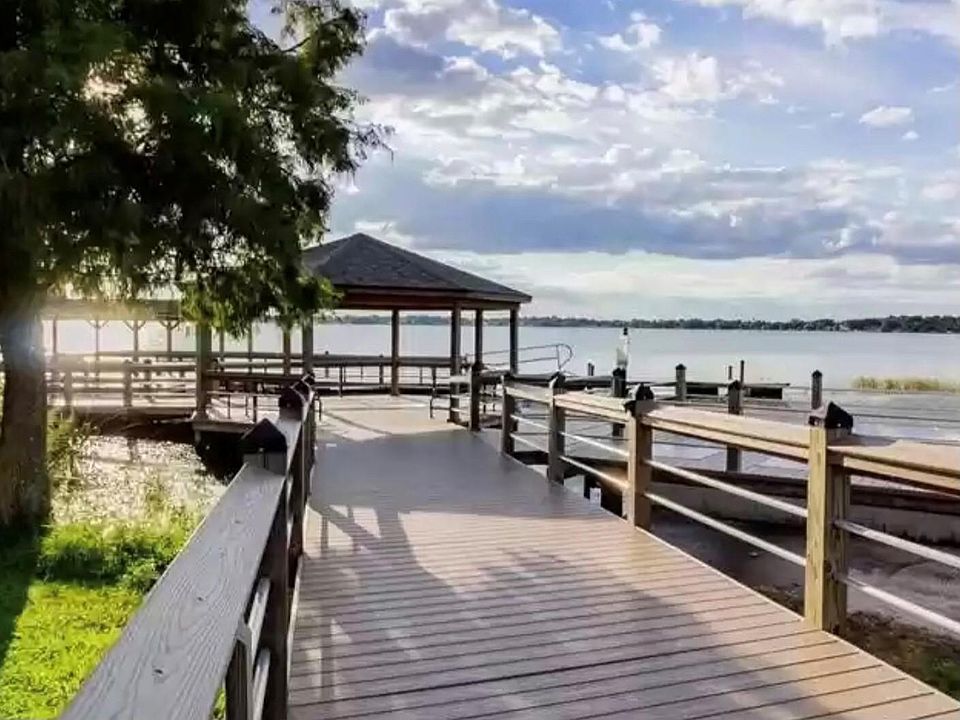 Public Dock to enjoy sitting, fishing or boating- just a few steps from condo