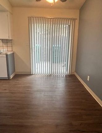 Dining area with ceiling fan, new paint, and vinyl plank flooring