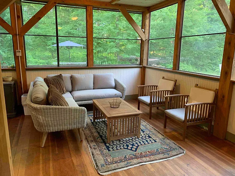 Screened porch with seating and dinning