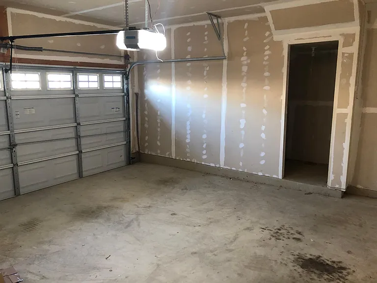 Extra storage room in the 2-car garage.