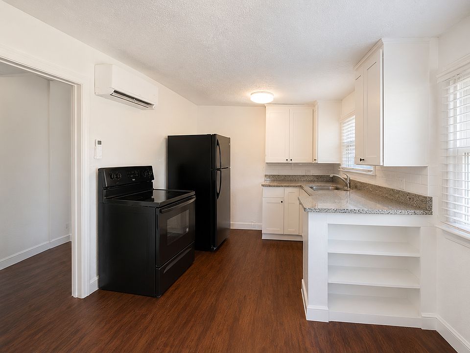 Functional kitchen with granite countertops and ample storage.