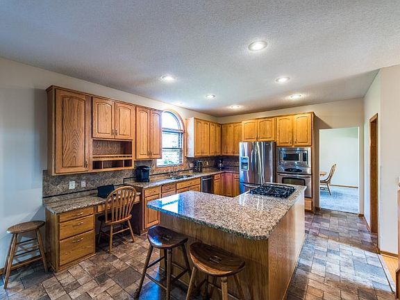 Warm, inviting kitchen with SS appliances and granite.  Work station is an added bonus.