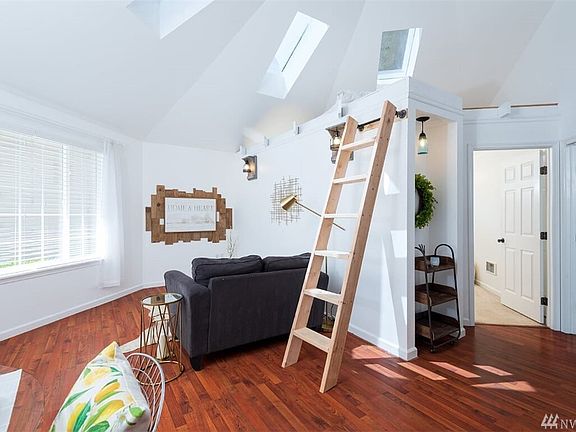 The ladder leads up to a loft area above the bedroom, seller is also happy to remove and restore back to the ope beam concept