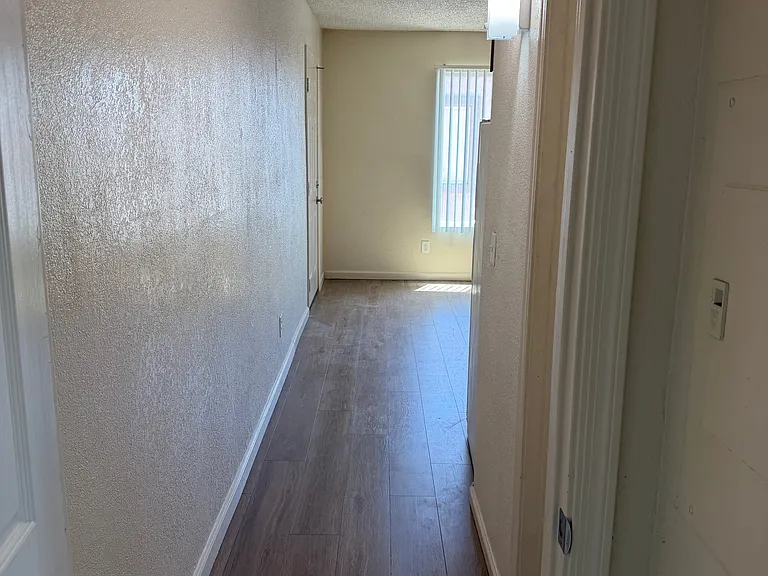Hallway looking towards living room and kitchen