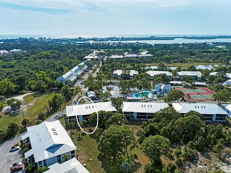 Prime placement at Unit 1003. _ Close enough to the pool for a morning swim, but backed up to the lush, quiet preserve for total relaxation. Whether you want to be social or secluded, this is the perfect home base for your Englewood getaway.