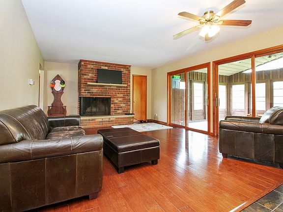 Beautiful hardwood floors and wood burning fireplace for this inviting family room
