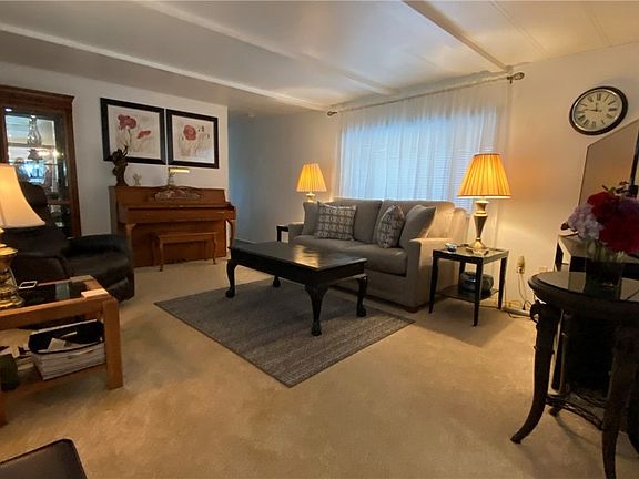 Relax, watch tv or read a book in this bright spacious living room.
