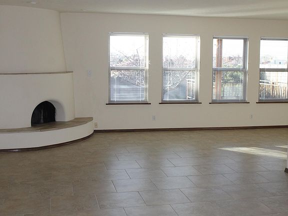LIVING ROOM WITH KIVA FIREPLACE