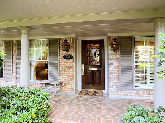 Stunning curb appeal from the moment you arrive! Brilliant gas lamps, sweeping front porch, immacula
