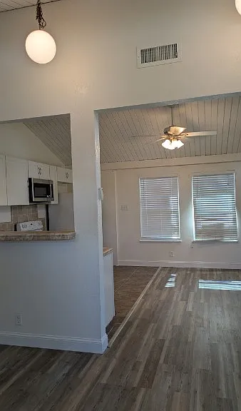 From your front door, you walk into an open concept living dining area with vaulted ceilings.