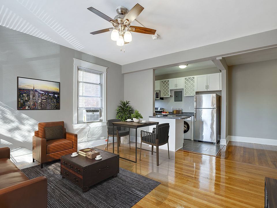 Renovated two-bedroom apartment living area (virtually staged)